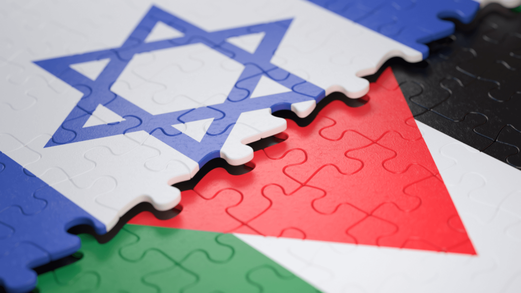Half-finished puzzles of the Israeli and Palestinian flags, the Israeli flag on top