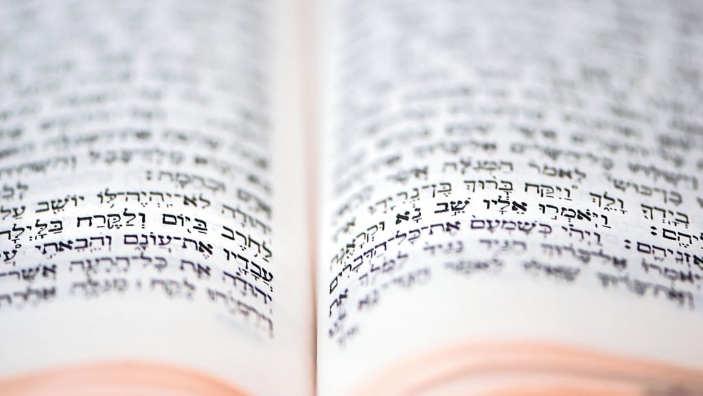 A close-up of a prayer book with Hebrew text