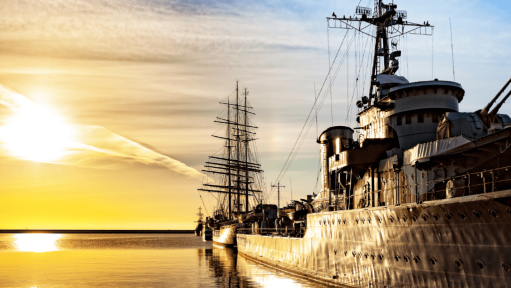 A Naval vessel on the water at sunrise
