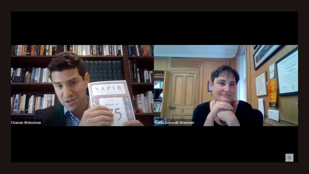 Two people on a video call; one holds a book titled SAPIR: Journal at 75, the other is listening attentively.