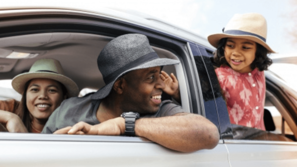 Multiracial family, a father, mother, and daughter, in a car together