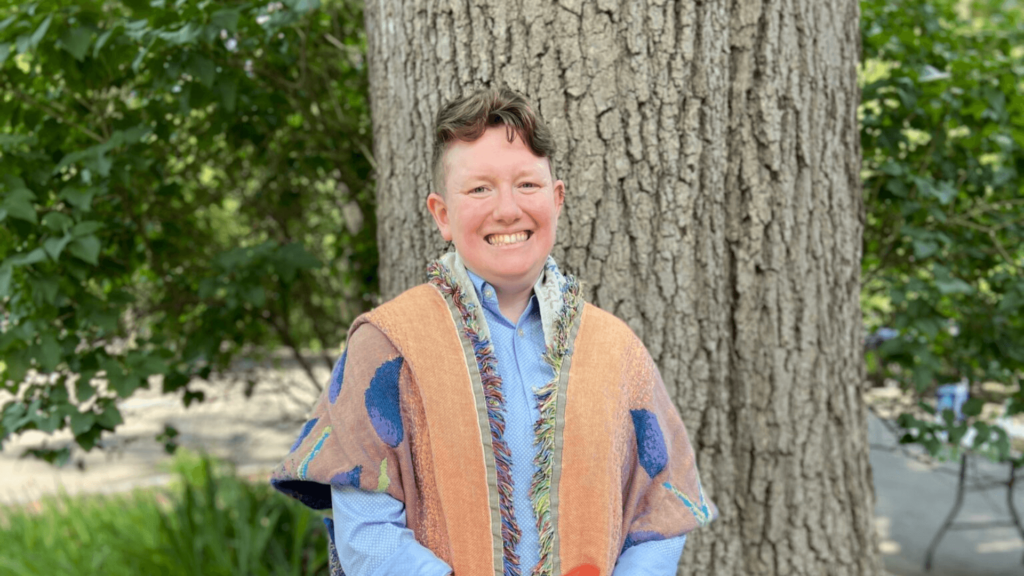 Rabbi Lily Solochek standing outside by a tree