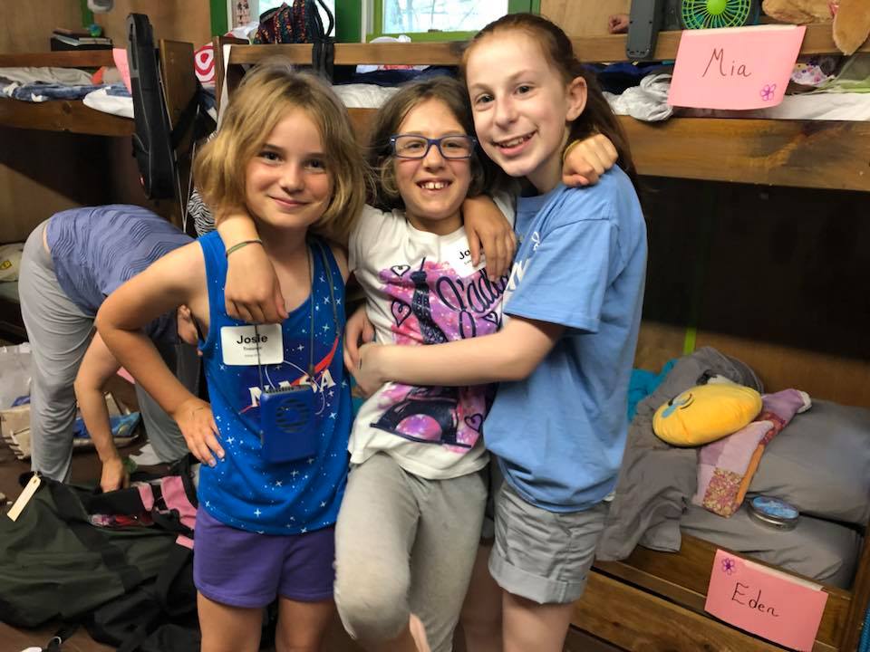 Three female campers in a Camp Havaya bunk.