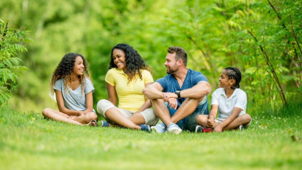 family sitting at park