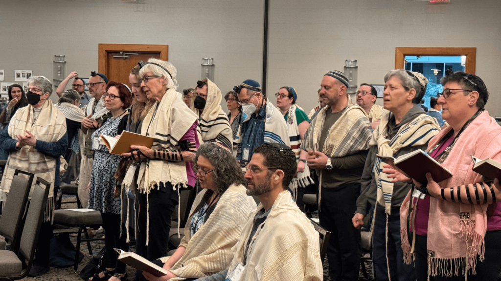 A diverse group of rabbis praying together