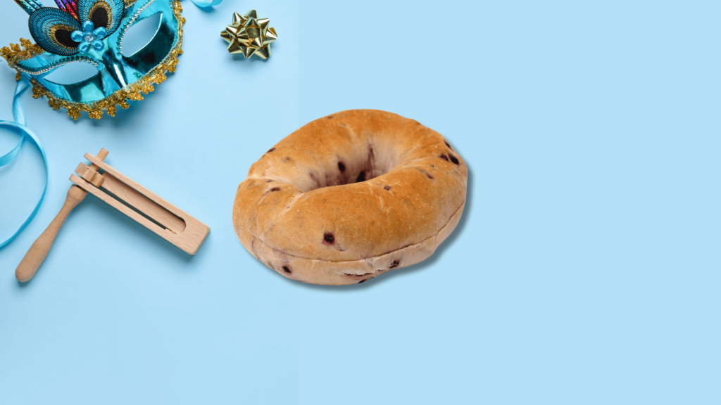 Blueberry bagel and grogger on a blue background