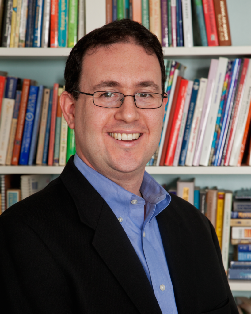 Rabbi William Plevan in a book-lined office
