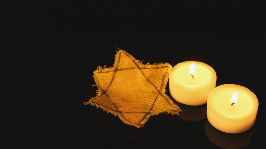 Star of David next to two candles