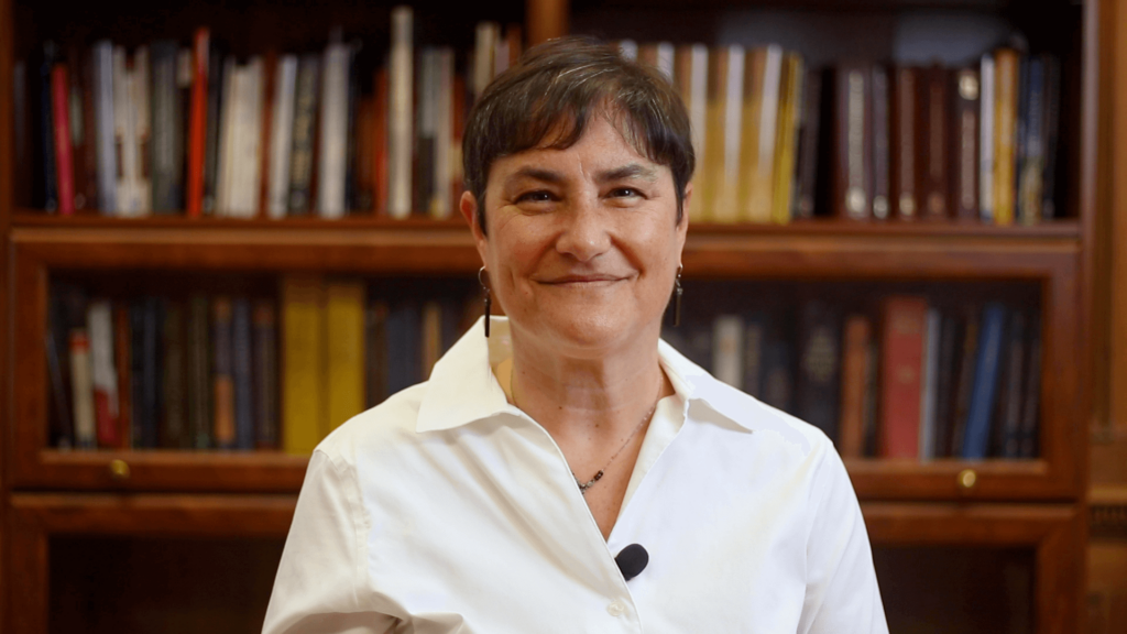 Rabbi Deborah Waxman in front of a bookshelf