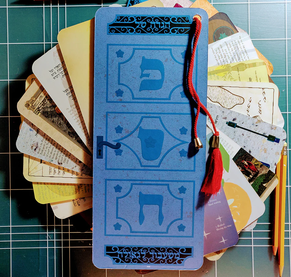 Colorful collection of illustrated cards with text, featuring a prominently decorated blue card with a red tassel.