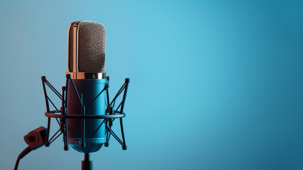 A vintage-style microphone on a stand against a blue gradient background.