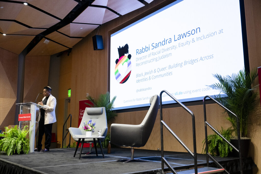 Full stage view of Rabbi Sandra Lawson speaking
