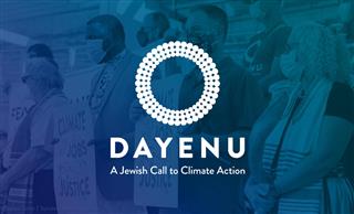 People gathered with signs; DAYENU: A Jewish Call to Climate Action logo in the foreground.