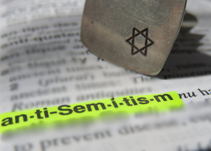 Highlighted word anti-Semitism in a dictionary, with a six-pointed star symbol nearby.