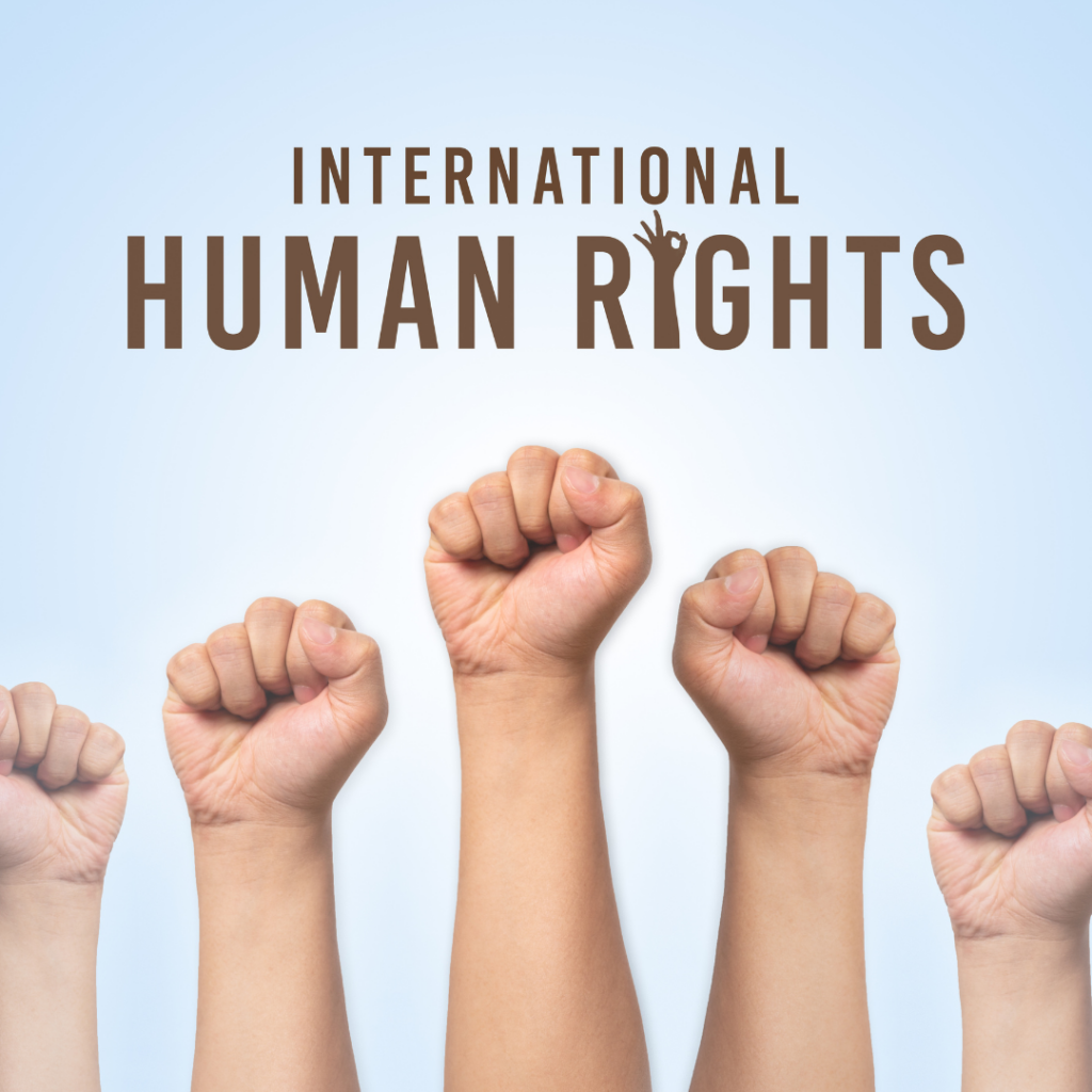 Raised fists under International Human Rights text on a light blue background.