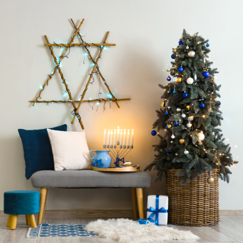 Festive room with a Hanukkah menorah, blue and silver decorated Christmas tree, and a Star of David wall decor.